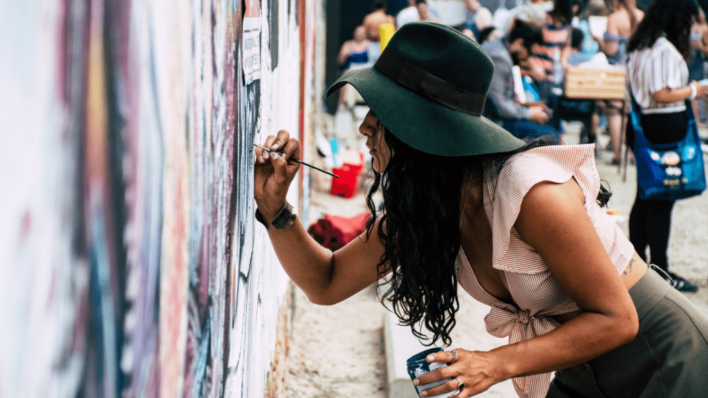 woman painting on the wall