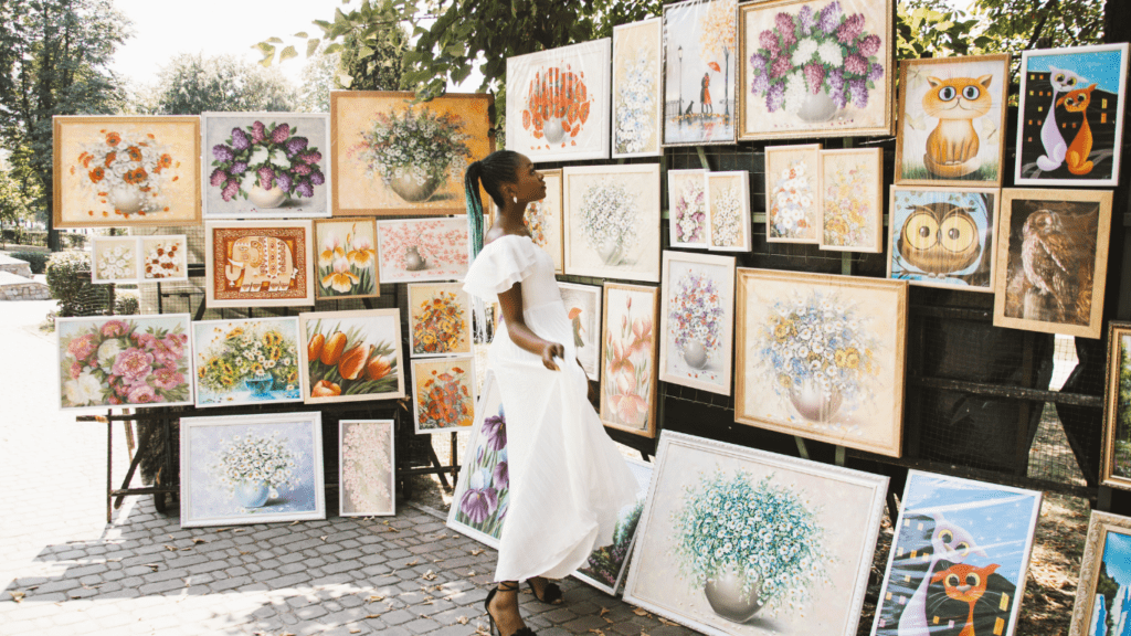 she's admiring her paintings