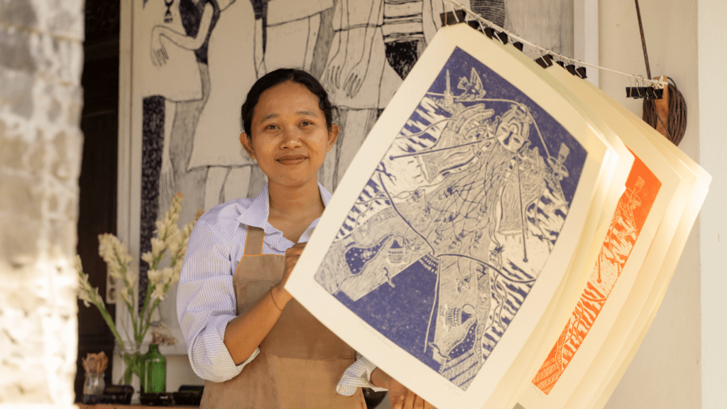 Artist hanging her Artwork